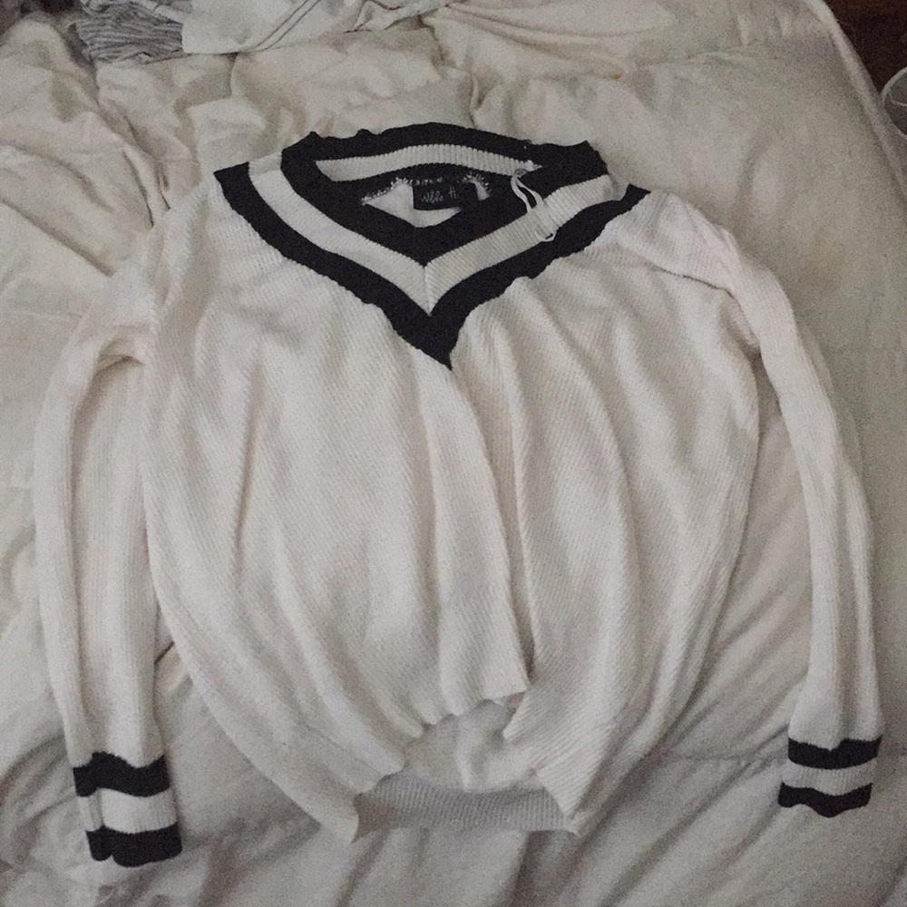 White sweater with black accents